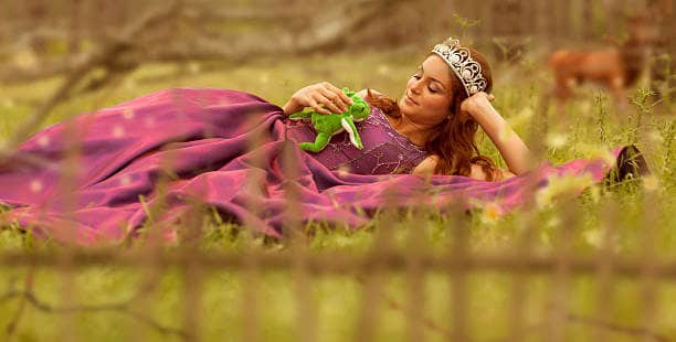 Beauty princess with frog in forest